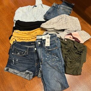 2 jeans 1 jean shorts 1 cargo pants 1 hoodie 2 off shoulder tops and 1 sweater